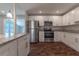 Updated kitchen with granite countertops and stainless steel appliances at 5709 Ridgeway Dr, Orlando, FL 32819