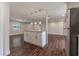 Modern kitchen island and open concept to living area at 5709 Ridgeway Dr, Orlando, FL 32819