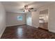 Spacious bedroom with dark wood floors and view of kitchen at 5709 Ridgeway Dr, Orlando, FL 32819