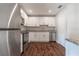 Renovated kitchen featuring stainless steel appliances and white cabinetry at 5709 Ridgeway Dr, Orlando, FL 32819
