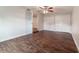 Bright bedroom with dark wood floors, ceiling fan and double door closet at 5709 Ridgeway Dr, Orlando, FL 32819