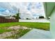 Large backyard with grassy area and concrete patio at 5709 Ridgeway Dr, Orlando, FL 32819