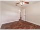Bright bedroom with dark wood floors, ceiling fan and double door closet at 5709 Ridgeway Dr, Orlando, FL 32819