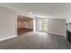 Gathering room with hardwood floors, fireplace, and view into living area at 5709 Ridgeway Dr, Orlando, FL 32819