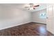 Bright bedroom with wood-look flooring and ceiling fan at 5709 Ridgeway Dr, Orlando, FL 32819