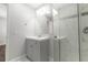 Clean bathroom with grey vanity, marble shower, and white toilet at 5709 Ridgeway Dr, Orlando, FL 32819