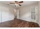 Bedroom with hardwood floors, ceiling fan, and private bathroom at 5709 Ridgeway Dr, Orlando, FL 32819