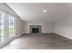 Gathering room featuring a fireplace and French doors leading to the backyard at 5709 Ridgeway Dr, Orlando, FL 32819