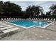 Inviting community pool with ample lounge chairs at 6214 Stevenson Dr # 103, Orlando, FL 32835