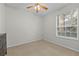 Well-lit bedroom featuring a ceiling fan and ample space at 6214 Stevenson Dr # 103, Orlando, FL 32835