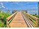 Wooden dock extending into the water with scenic views at 70 Millholland St, Oakland, FL 34760