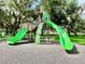 Modern playground featuring slides, climbing wall, and a safe surface at 70 Millholland St, Oakland, FL 34760
