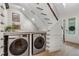 Convenient laundry room with front-loading washer and dryer at 70 Millholland St, Oakland, FL 34760