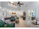 Large living room with sectional sofa and access to kitchen and pool at 70 Millholland St, Oakland, FL 34760