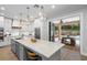 Modern kitchen with large island, stainless steel appliances, and white cabinetry at 70 Millholland St, Oakland, FL 34760