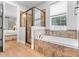 Bathroom featuring a soaking tub and walk-in shower at 70 Millholland St, Oakland, FL 34760