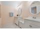 Clean bathroom with white cabinets and a double vanity at 70 Millholland St, Oakland, FL 34760
