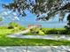 Waterfront view with a wooden walkway to a dock at 70 Millholland St, Oakland, FL 34760
