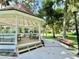 Quaint gazebo with picnic tables and benches, perfect for outdoor gatherings at 70 Millholland St, Oakland, FL 34760