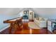 Bright game room with hardwood floors, a shuffleboard table, and comfortable seating at 70 Millholland St, Oakland, FL 34760