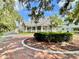 Charming Craftsman-style home with a wrap-around porch and beautifully landscaped grounds at 70 Millholland St, Oakland, FL 34760