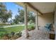 Inviting front porch with brick flooring, columns, and comfortable seating at 70 Millholland St, Oakland, FL 34760