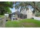 Home with a screened pool and lanai in a lush backyard setting at 70 Millholland St, Oakland, FL 34760