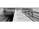 Black and white image of a wooden dock at 70 Millholland St, Oakland, FL 34760