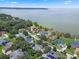 Community overview showcasing waterfront homes with lush landscaping and lake views at 70 Millholland St, Oakland, FL 34760