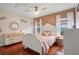 Charming bedroom with a white bed frame and pink bedding at 70 Millholland St, Oakland, FL 34760