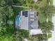 Aerial view of house, pool, and surrounding landscape at 70 Millholland St, Oakland, FL 34760