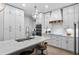 Bright kitchen features white cabinets, a large island, and stainless steel appliances at 70 Millholland St, Oakland, FL 34760