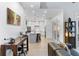 Open concept living room with a view into the kitchen at 70 Millholland St, Oakland, FL 34760