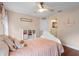 Light and airy bedroom with a white bed frame and colorful accents at 70 Millholland St, Oakland, FL 34760