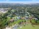 Wide shot of lakefront community with various houses and lush greenery at 70 Millholland St, Oakland, FL 34760
