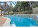 Screened pool and patio with a waterfall feature at 70 Millholland St, Oakland, FL 34760
