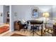 Charming music room with piano, chair, and hardwood floors at 130 Golf Vista Cir, Davenport, FL 33837