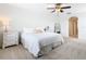 Bright and airy main bedroom with a king-size bed and en-suite bathroom at 8920 Dove Valley Way, Davenport, FL 33896