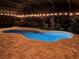 Night view of a lovely pool area with lights at 8920 Dove Valley Way, Davenport, FL 33896