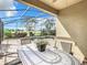 Relaxing pool area with covered patio and outdoor seating at 8920 Dove Valley Way, Davenport, FL 33896