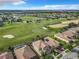 Aerial view showing homes and a golf course at 8920 Dove Valley Way, Davenport, FL 33896