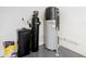 Utility room with water softener and water heater at 8920 Dove Valley Way, Davenport, FL 33896