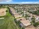 Aerial view of the community with numerous houses and a golf course at 8920 Dove Valley Way, Davenport, FL 33896