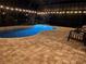 Night view of a relaxing pool area with lights at 8920 Dove Valley Way, Davenport, FL 33896