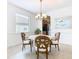 Elegant dining area with a wood table and four chairs at 8920 Dove Valley Way, Davenport, FL 33896