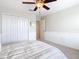 Bedroom with double door closet and ceiling fan at 8920 Dove Valley Way, Davenport, FL 33896