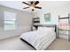 Bedroom with a queen bed and built-in desk at 8920 Dove Valley Way, Davenport, FL 33896