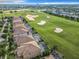 Aerial view of houses near a golf course at 8920 Dove Valley Way, Davenport, FL 33896