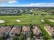 Aerial view of houses and a golf course at 8920 Dove Valley Way, Davenport, FL 33896