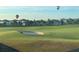View of a golf course with hot air balloons in the distance at 8920 Dove Valley Way, Davenport, FL 33896